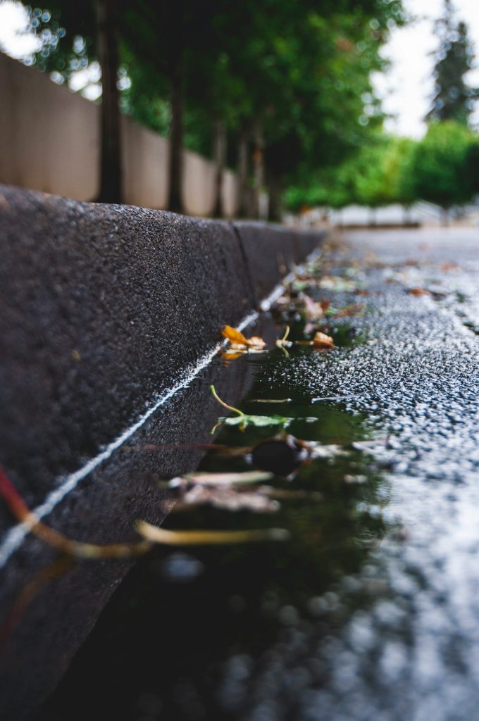 water droplets on gray concrete wall